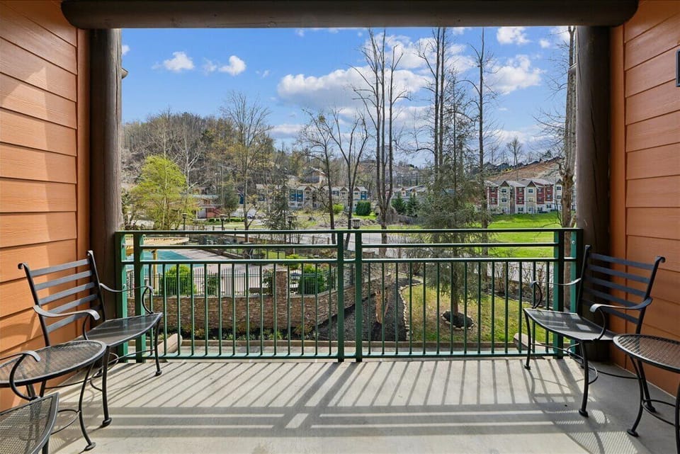 Step onto your private balcony and enjoy peaceful neighborhood views with comfortable seating for morning coffee or evening relaxation.