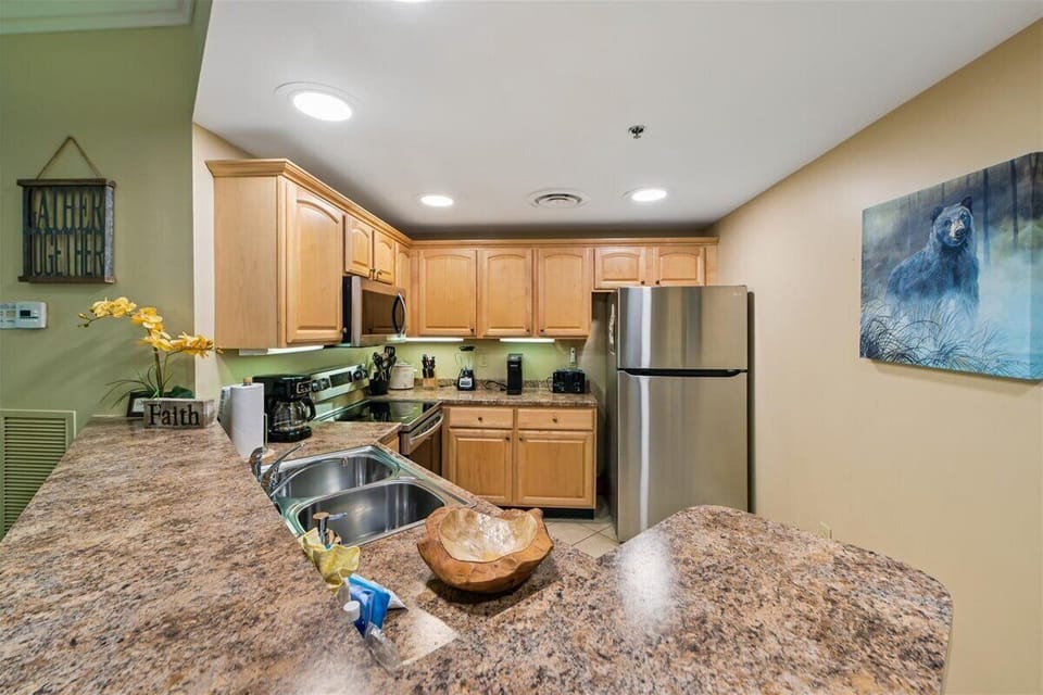 Your fully-equipped kitchen features granite countertops, stainless steel appliances, and everything you need to create memorable meals during your stay.