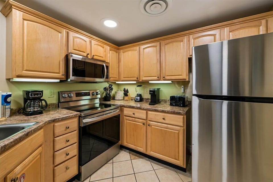 Your fully equipped kitchen features granite counters, stainless steel appliances, and everything needed for memorable meals during your stay.