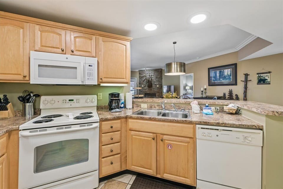 Your fully equipped kitchen awaits with granite counters, modern appliances, and open layout perfect for cooking memorable meals together.
