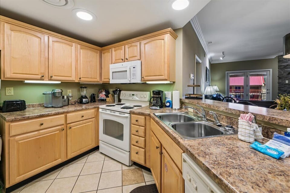 Cook your favorite meals in this fully equipped kitchen with granite counters, modern appliances, and everything you need for a comfortable stay.