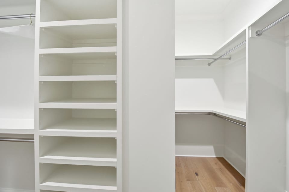 Your generous walk-in closet features built-in shelving and hanging rods, giving you plenty of space to organize all your belongings.