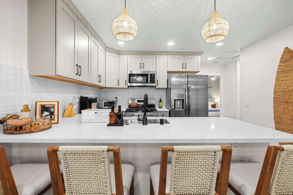 This bright, open space is the perfect for the home, offering plenty of room to cook, eat, and plan your next beach day.