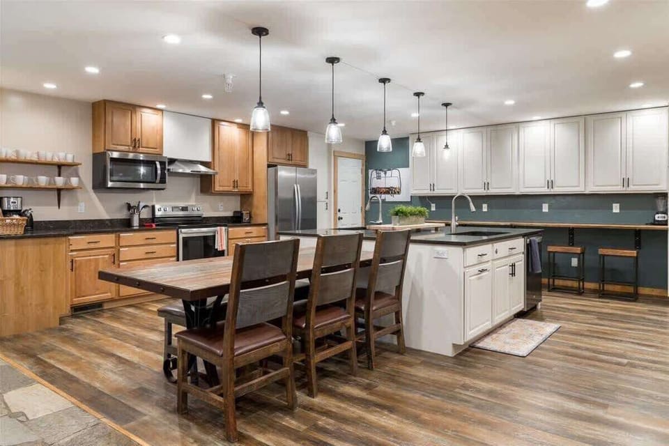 Massive double kitchen with 2 of every appliance and additional seating to supplement the dining table