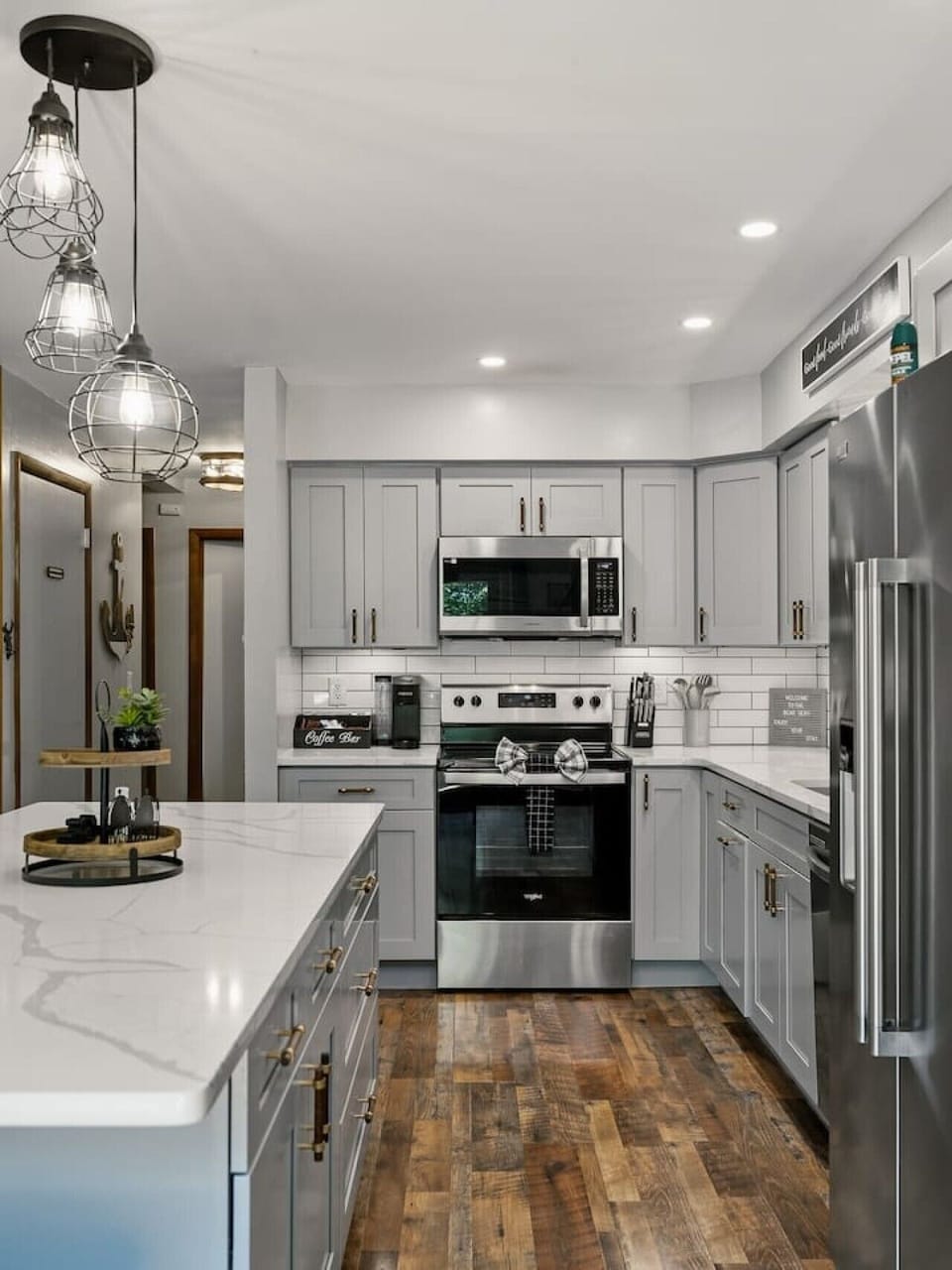 Kitchen features barstool seating for 6