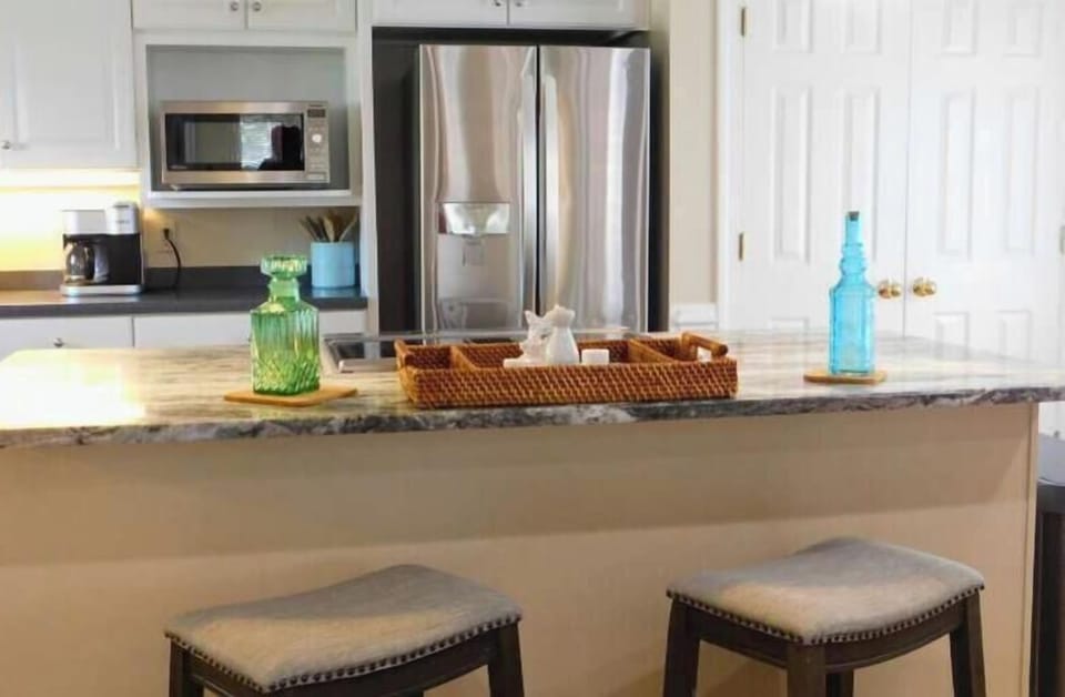 Kitchen Island with flat top stove, microwave and all cooking essentials