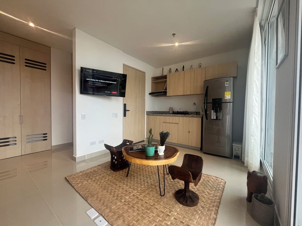 Apartment, Balcony, Beach View | Living area | 55-inch flat-screen TV with digital channels