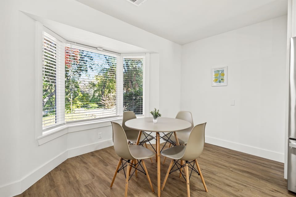 Cozy breakfast corner with seating for four for casual meals and morning coffee.