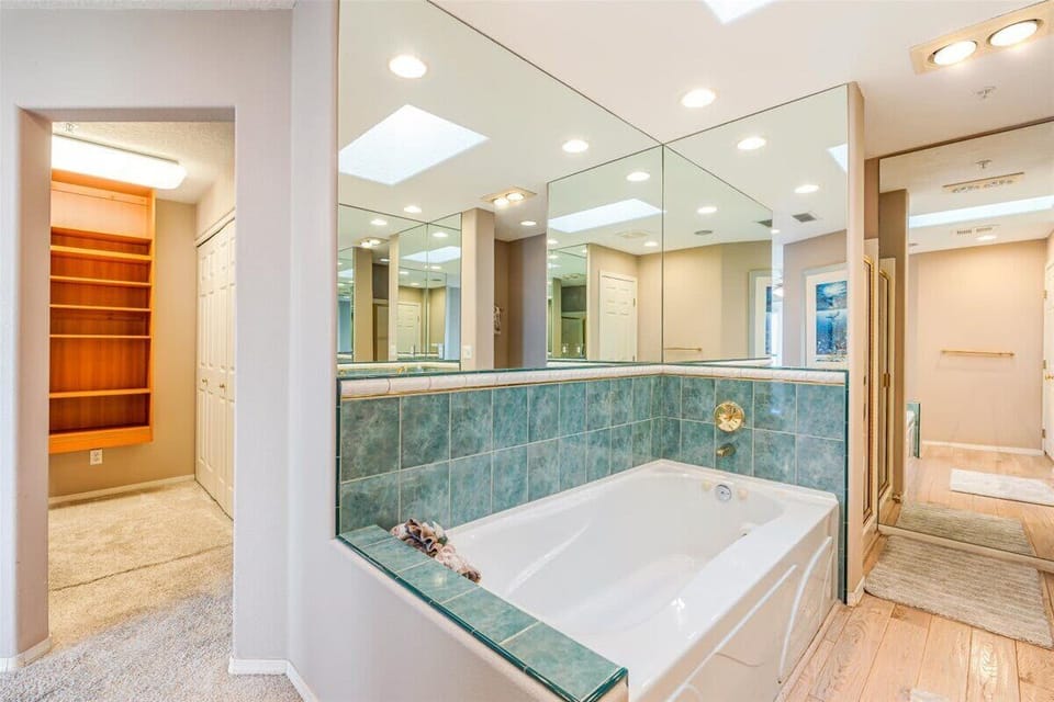 The inviting jetted tub creates the perfect place to unwind after a day at the beach.