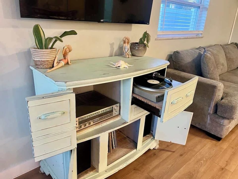 Record player along with many records and radio, to allow you to enjoy some great music and do some dancing! 
