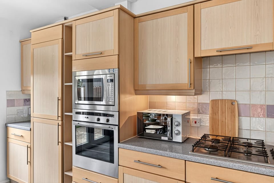 A fully equipped kitchen, complete with everything you need to prepare a home-cooked meal.