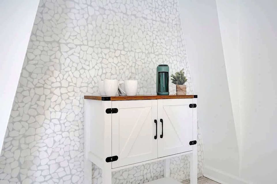 Coffee and tea station with decorative accent wall