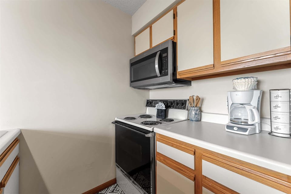 The open kitchen offers ample space & all the comforts of home​