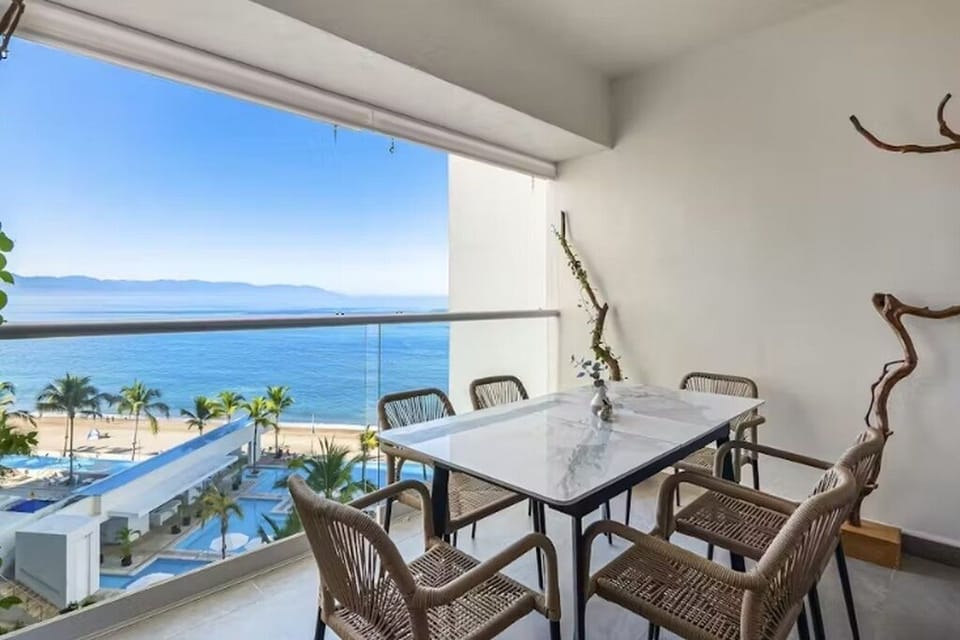 Marble patio dining set with a serving bar and a beautiful ocean view.
