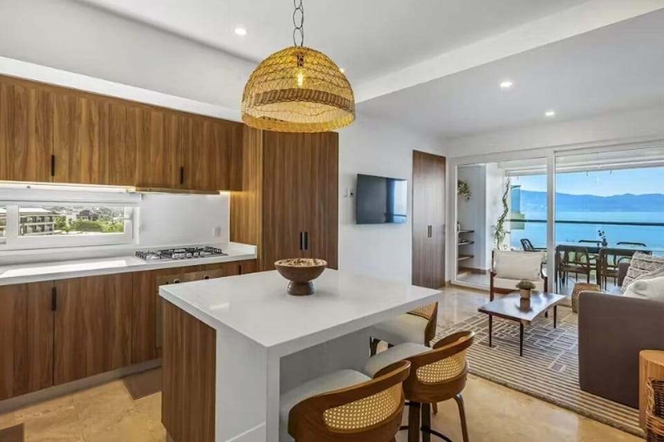 Kitchen with a large pantry, smart TV, patio dining area with a service bar.