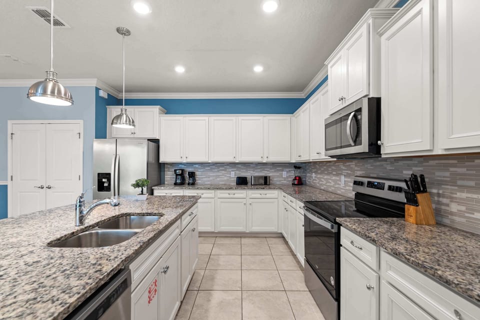 Kitchen with full setup and center island ideal for cooking, prepping, and sharing meals