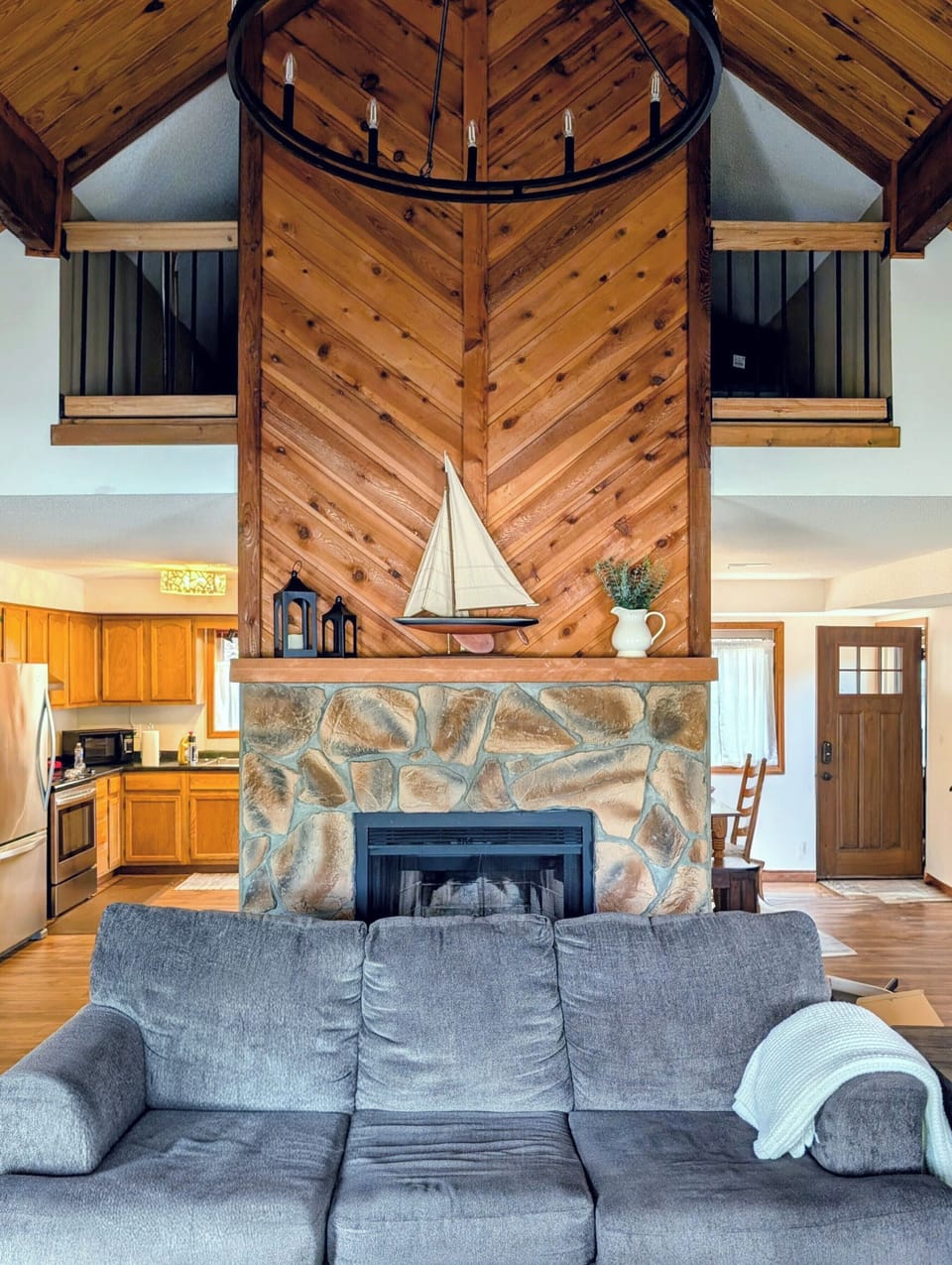 Fireplace • Hideaway sofa with a view of the lake • Loft overlook 