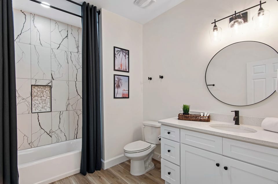 Your beautifully appointed bathroom features marble tile, modern fixtures, and thoughtful touches that make your daily routine feel luxurious and refreshing.