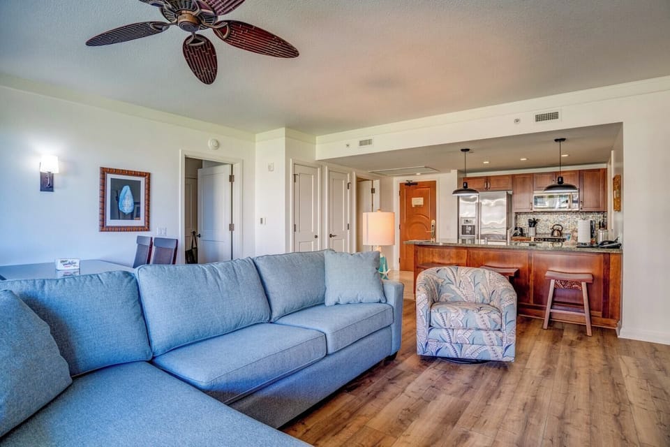 Chic yet cozy—this stylishly furnished living room with coastal accents offers the ultimate retreat for your Hawaiian escape HKH-211