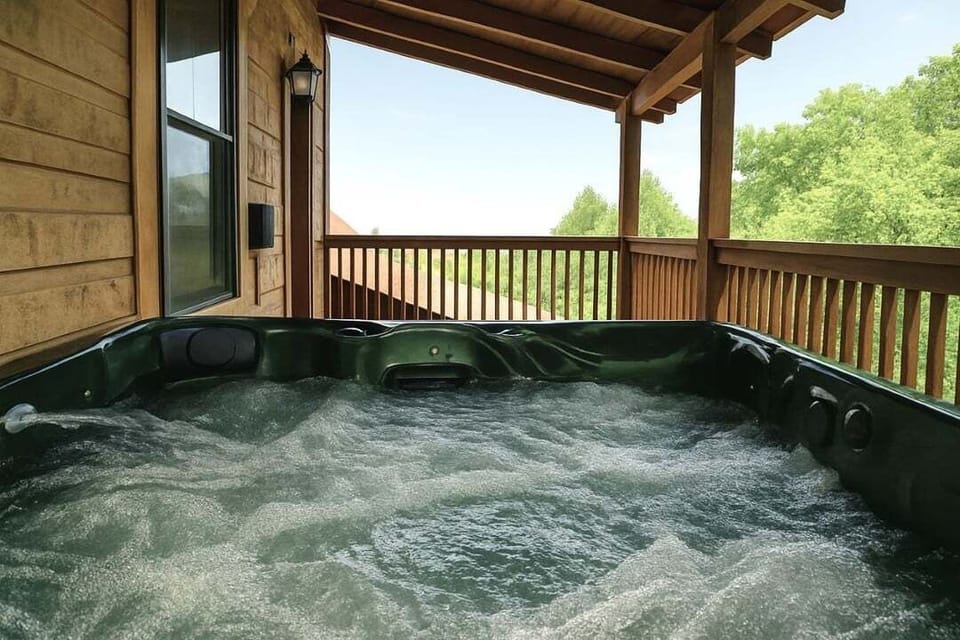 Brand new hot tub on the upper deck at Mountain Paradise log cabin in Wears Valley, Tennessee — soak away the day with peaceful mountain views surrounding you