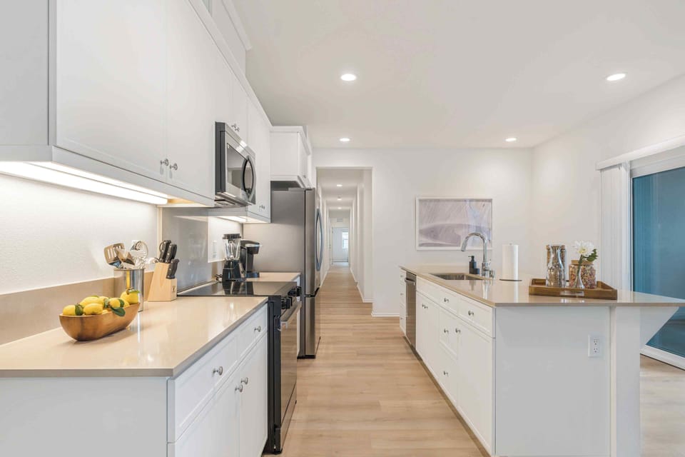 Sleek shaker-style cabinetry provides ample storage for all your culinary needs.