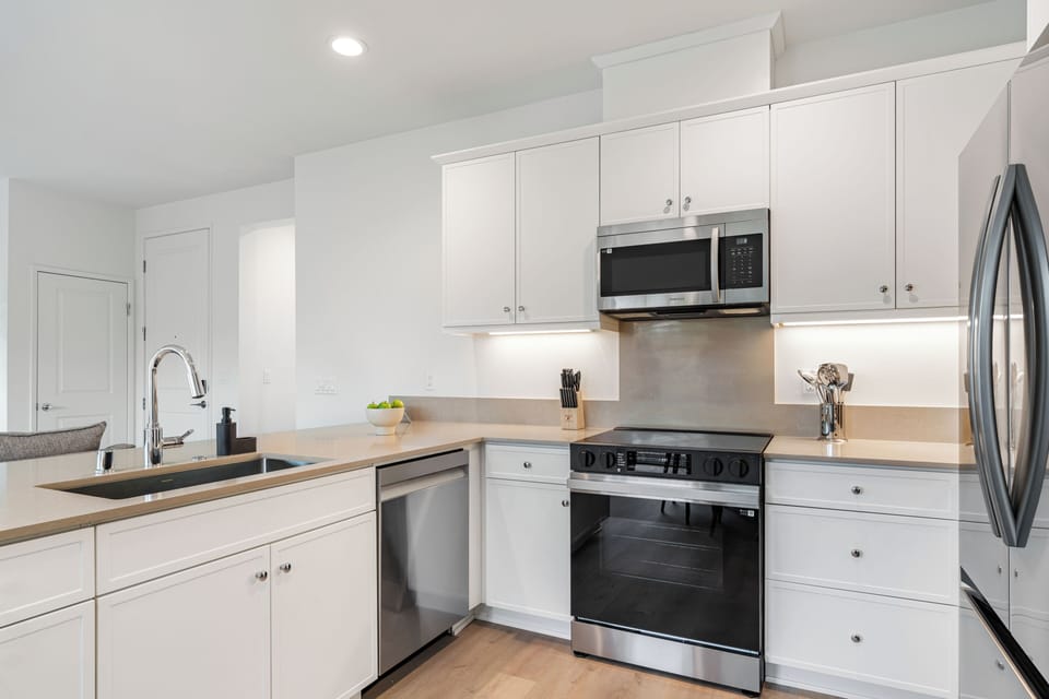 Whip up your favorite meals in a chef-inspired kitchen featuring premium stainless steel appliances.