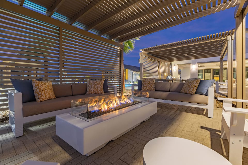 Cozy up by the outdoor fire pit and enjoy the stunning desert sunset.