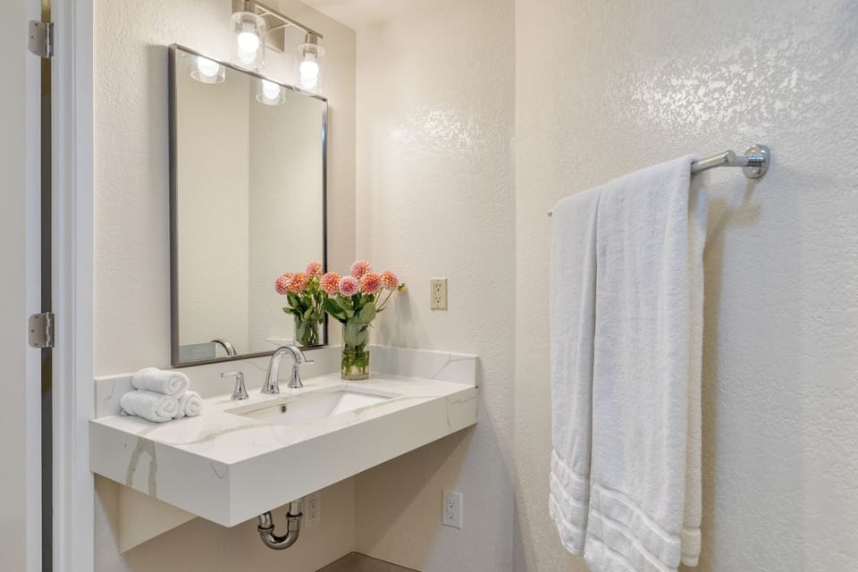 The bathroom features a shower.