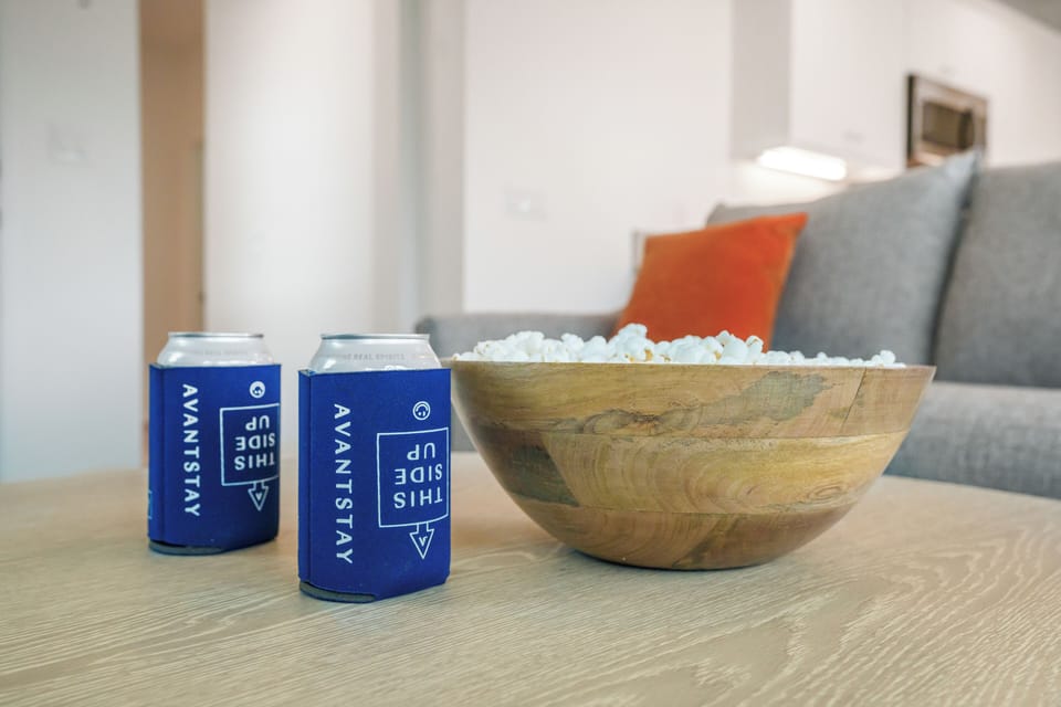 Movie night essentials: a cozy lounge and plenty of snacks for the ultimate group hangout.
