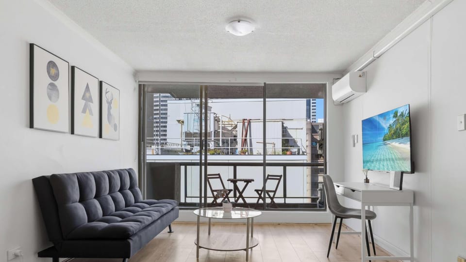 Stylish living room with TV and balcony access