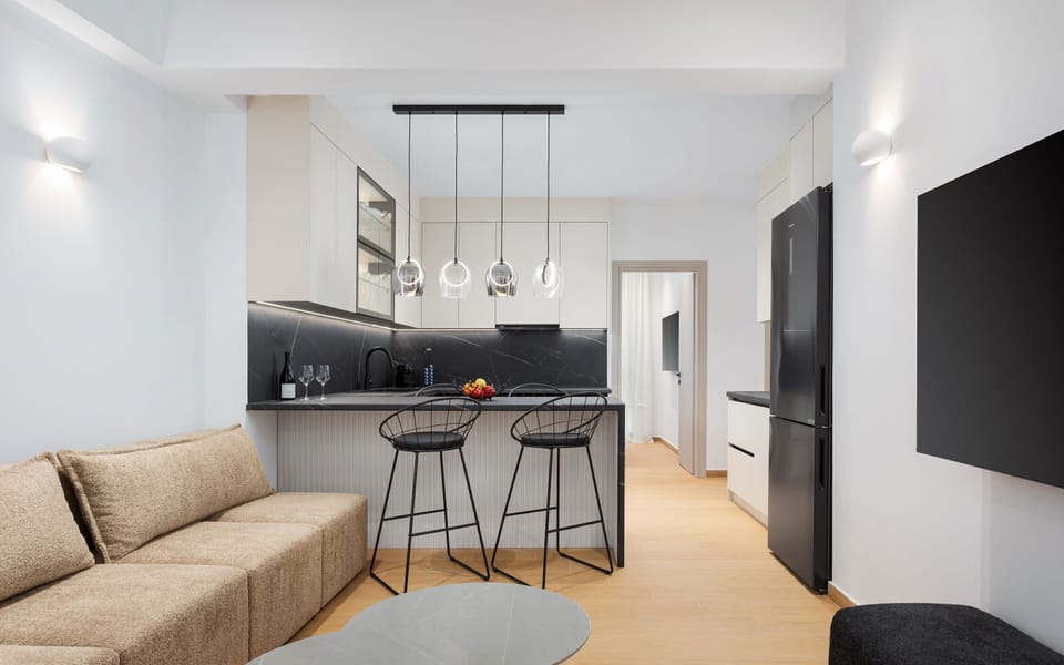 Deluxe Apartment | Living area | 65-inch Smart TV with cable channels, Netflix, streaming services