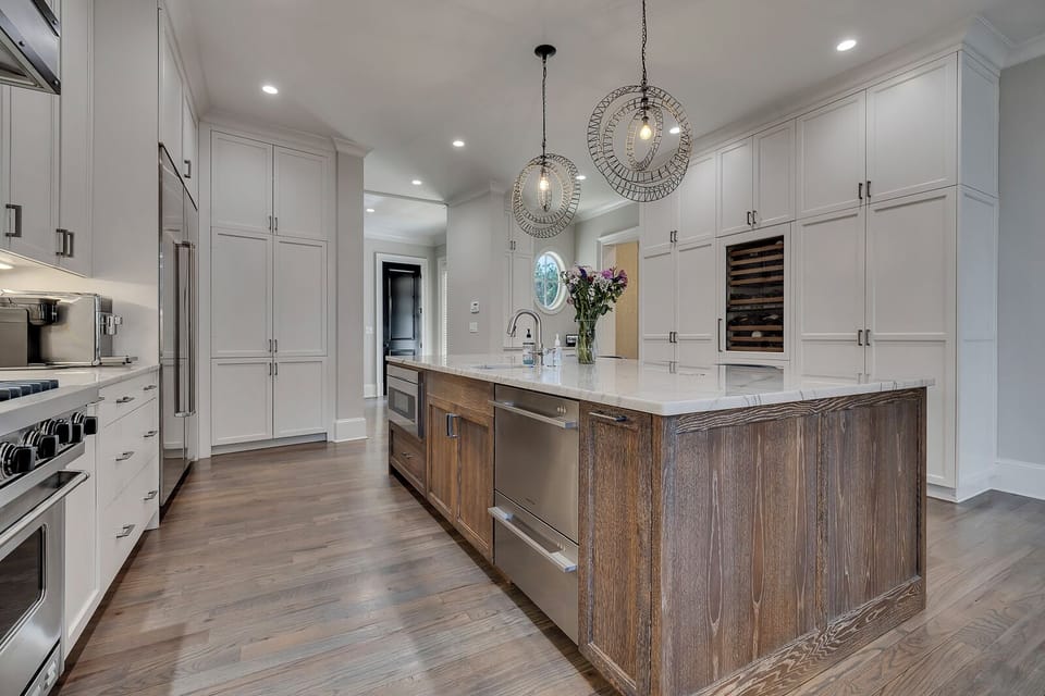 Spacious kitchen w/ dual dishwashers & clean cabinetry for effortless hosting
