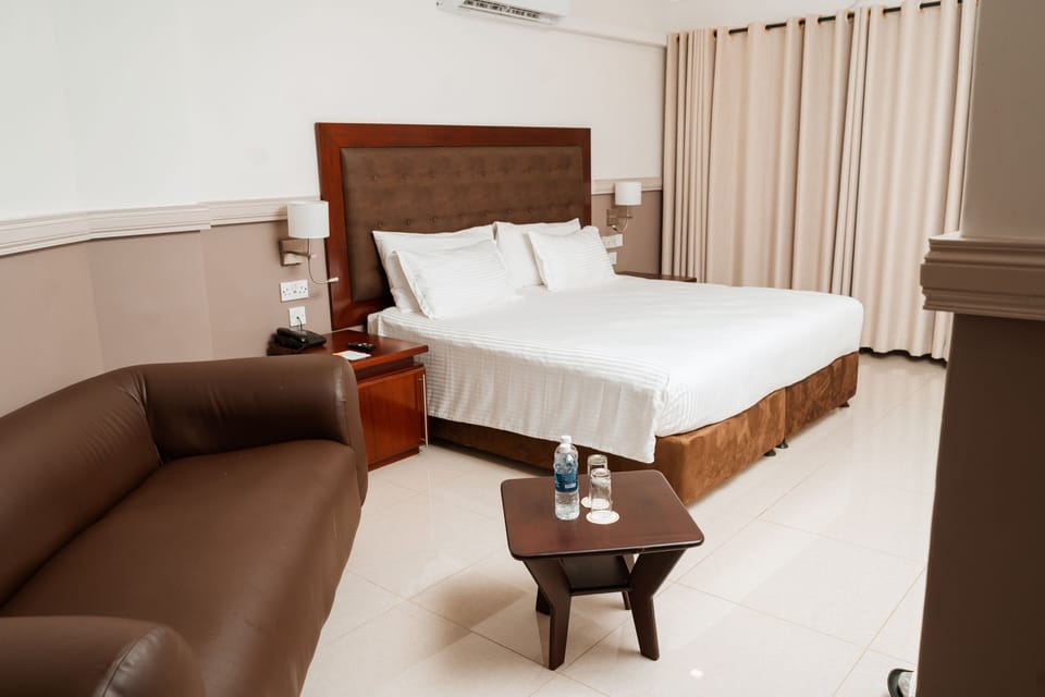 Blackout drapes, iron/ironing board, bed sheets, alarm clocks