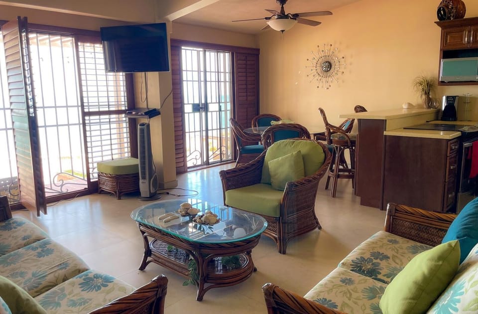 Relax on the comfortable couch and watch TV in this spacious San Felipe BC rental living room.