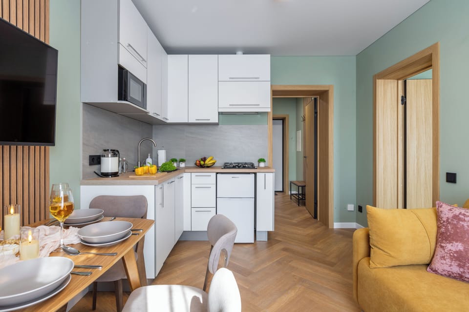 Superior Apartment, City View | Private kitchen | Griddle, cleaning supplies, paper towels, dining table