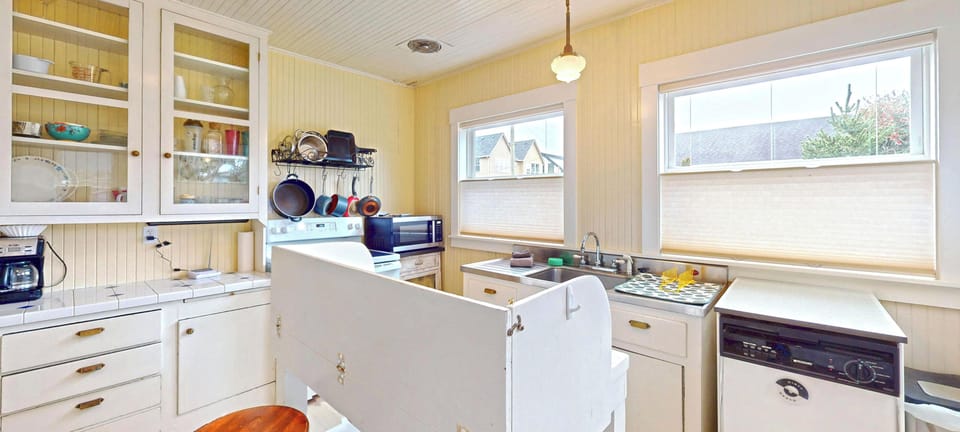 Your fully equipped kitchen welcomes you with vintage charm and modern amenities for memorable meal preparations together.