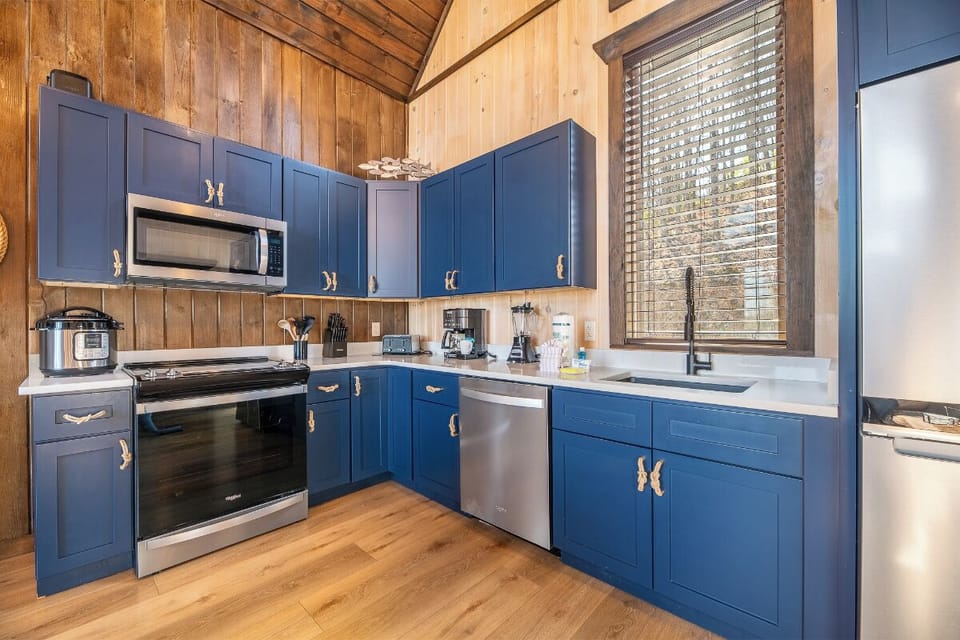 Your fully equipped kitchen features modern appliances and rustic charm, perfect for preparing memorable meals during your stay.