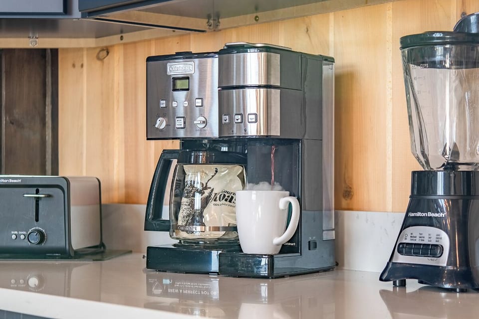 Wake up to freshly brewed coffee from your fully equipped kitchen, complete with premium appliances to start your morning perfectly.