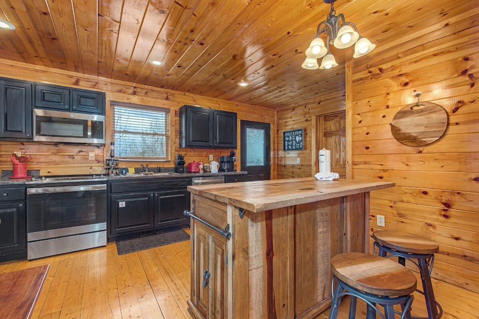 You'll love cooking in this rustic mountain kitchen with its warm wood cabin feel and modern appliances for all your vacation meal prep.