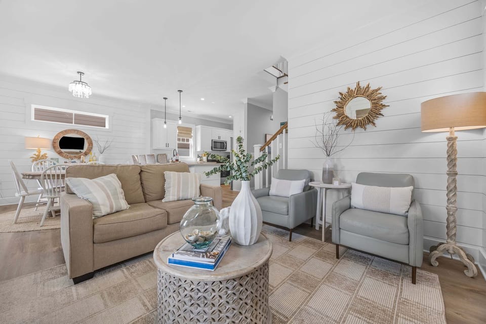 Cozy coastal-inspired living room with comfortable seating provides the perfect place to unwind with family and friends.