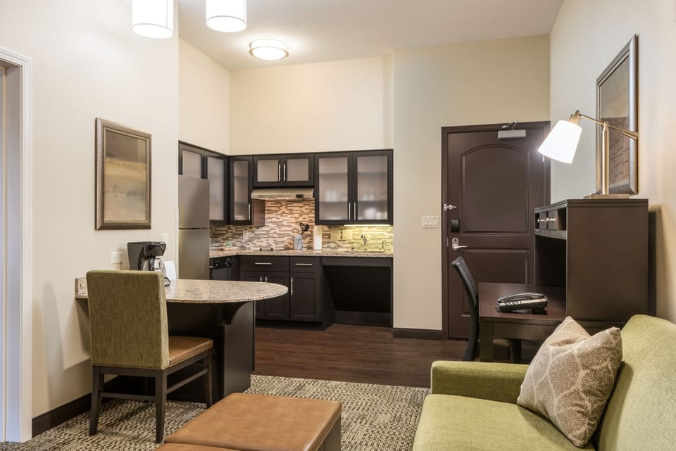 Premium bedding, desk, laptop workspace, blackout drapes