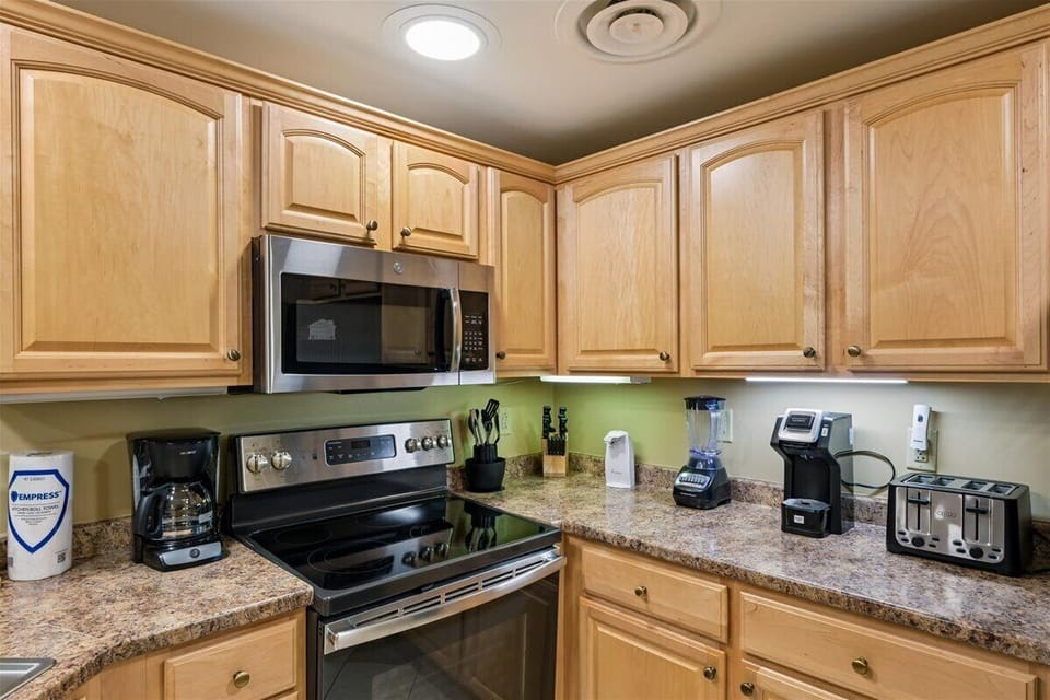 Your fully equipped kitchen awaits with granite countertops, stainless steel appliances, and everything you need to create memorable meals during your stay.