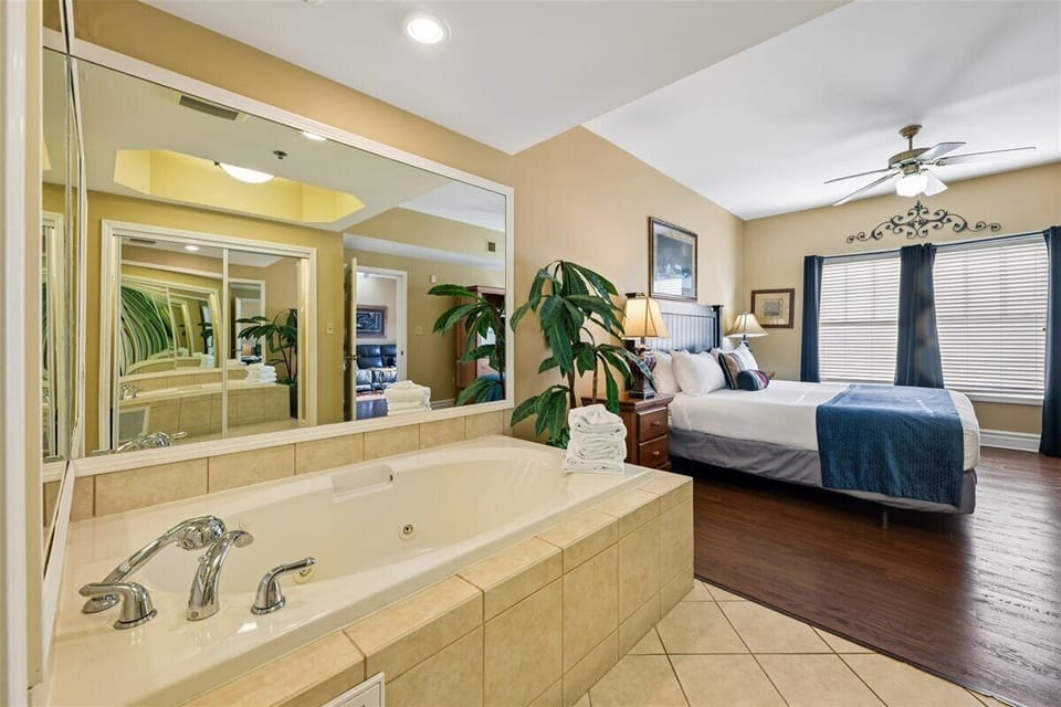 Your spacious retreat features a romantic jetted tub where you can unwind while enjoying the view of your cozy bedroom.