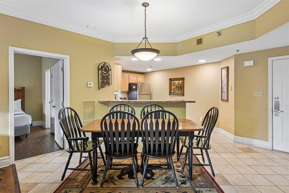 Gather around your spacious dining table where family meals become cherished memories, with the kitchen just steps away for easy entertaining.