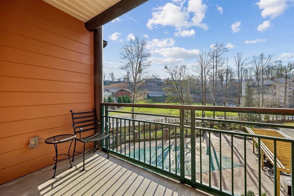 Step onto your private balcony and sip morning coffee while enjoying peaceful pool views and rolling green landscapes.