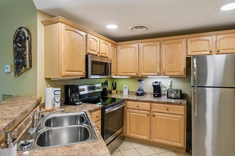 Your fully equipped kitchen features granite countertops, stainless steel appliances, and everything you need to create delicious meals during your stay.