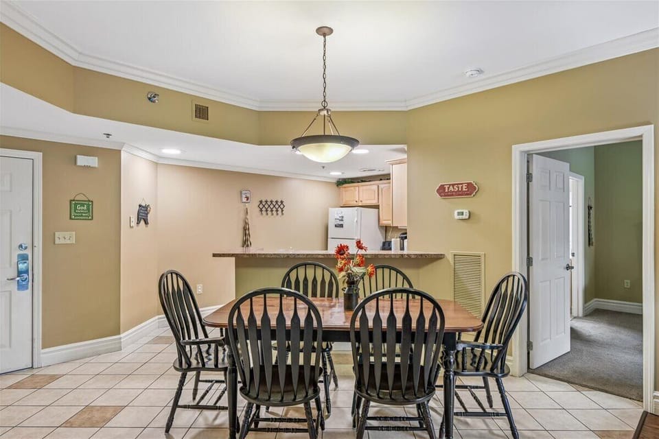 Gather around your spacious dining table for memorable meals together, with the open kitchen perfect for easy entertaining.
