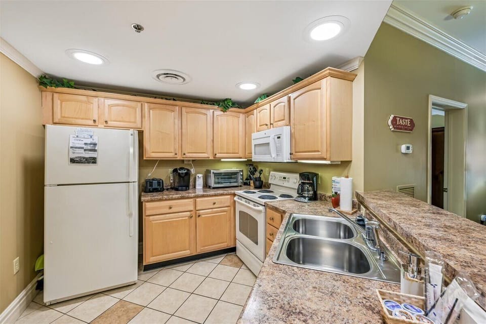 Your fully equipped kitchen awaits with granite counters, modern appliances, and everything you need to create memorable meals during your stay.