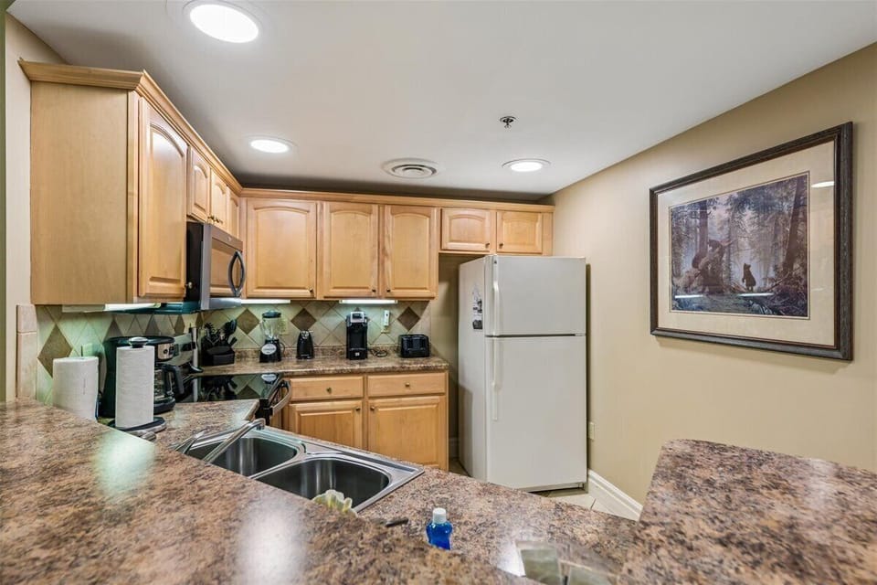 Your fully equipped kitchen features granite countertops, modern appliances, and everything you need to prepare meals during your stay.
