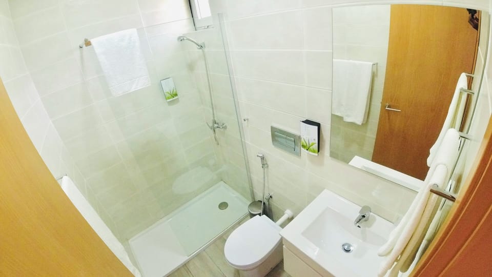 Basic Double Room, Patio, Pool View | Bathroom | Shower, slippers, towels, soap
